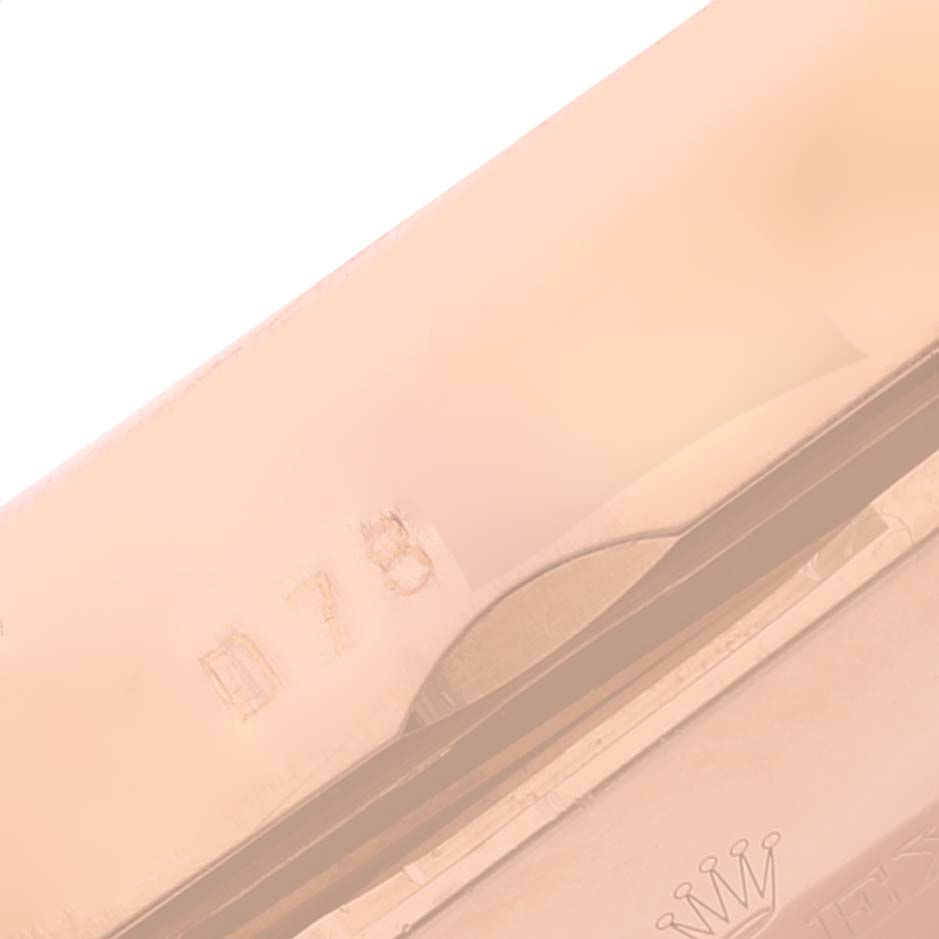 This image shows a close-up view of the clasp and part of the case back of a Rolex Cellini 5442 Men's Rose Gold Black Dial 5442 Men's Rose Gold Black Dial watch.