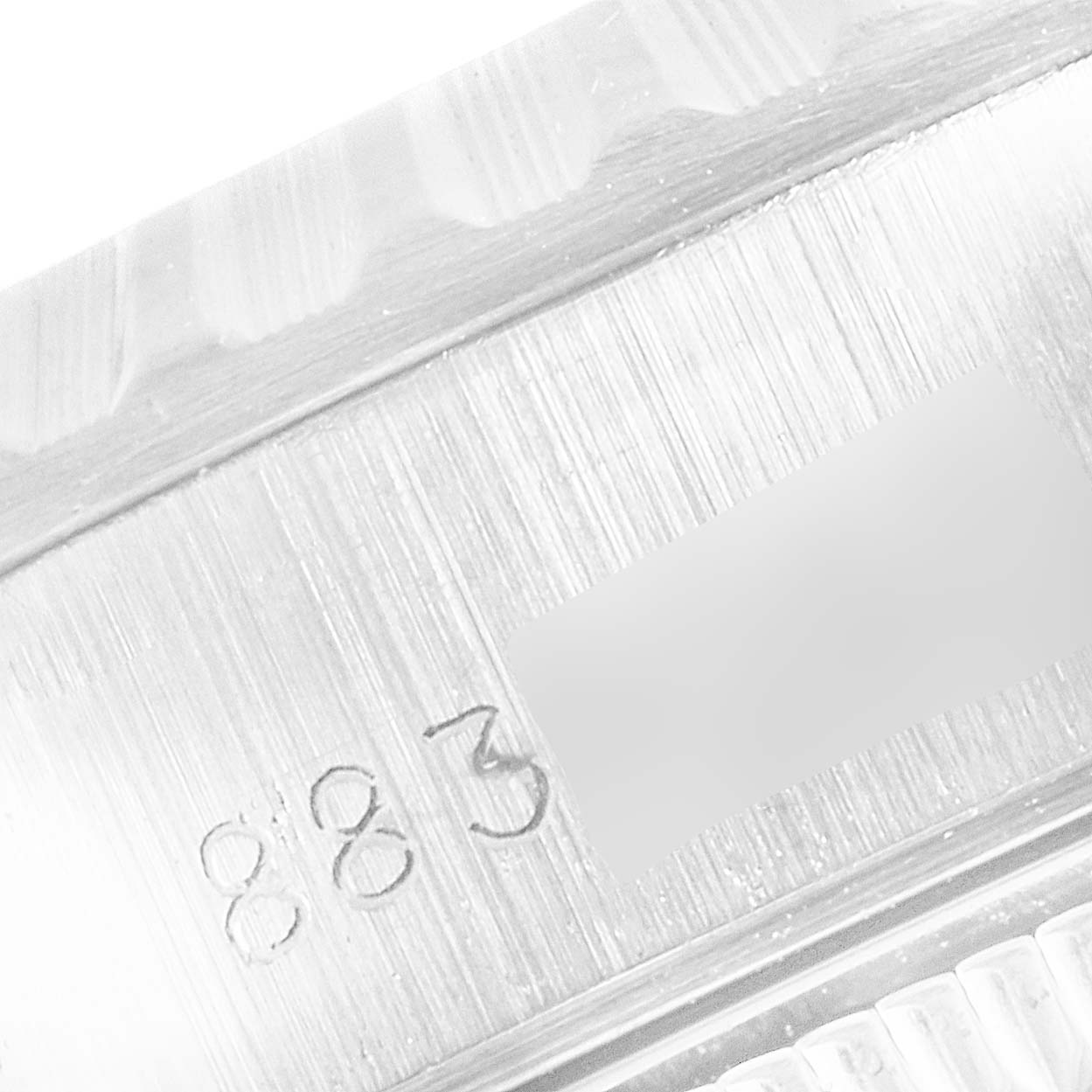 This image shows a close-up view of the serial number engraving on a Rolex Date 69240 Women
s Stainless Steel Pink Dial 69240 Women
s Stainless Steel Pink Dial model watch.