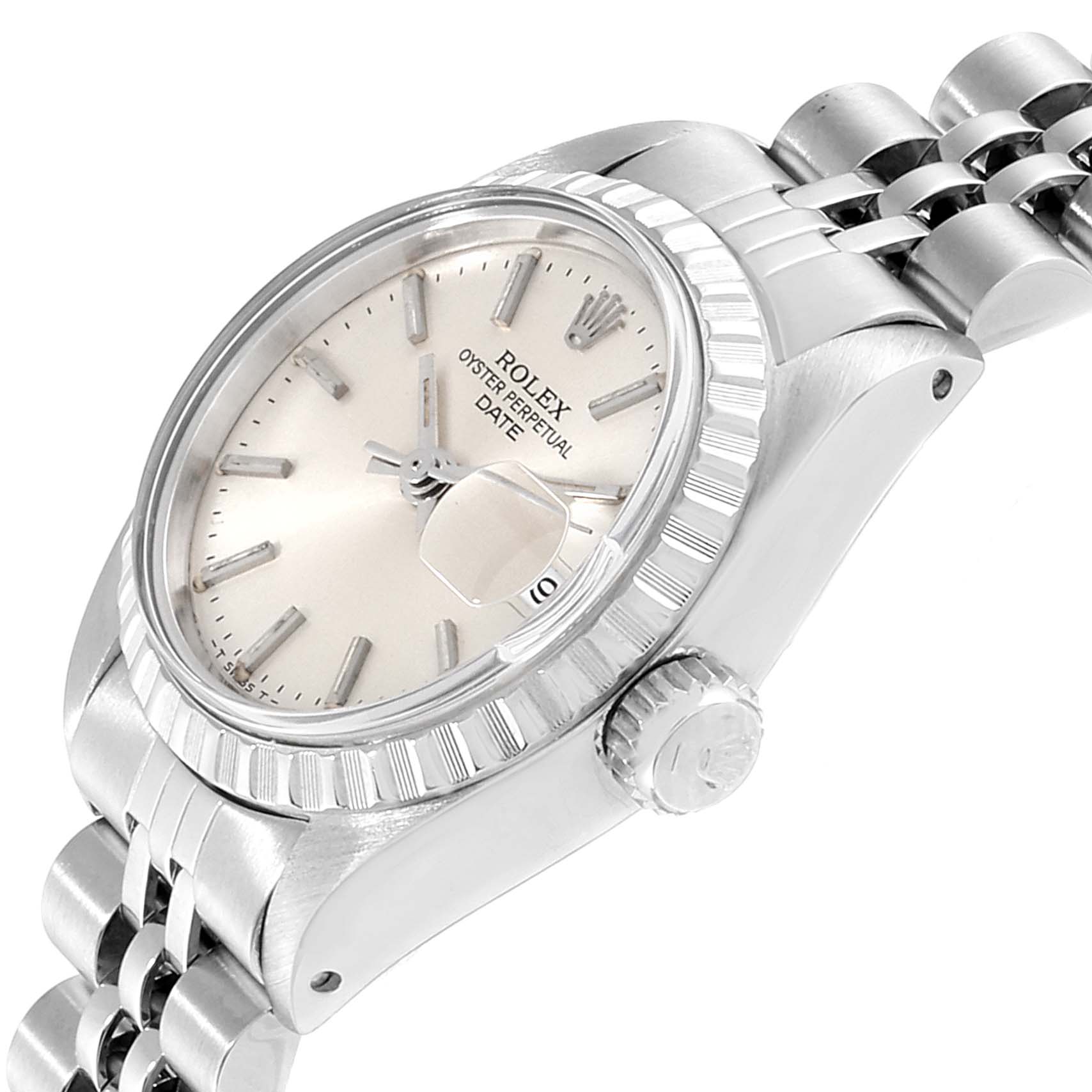 The image shows the face, crown, and partially the bracelet of a Rolex Date 6924 Women's Stainless Steel Silver Dial 6924 Women's Stainless Steel Silver Dial model watch.