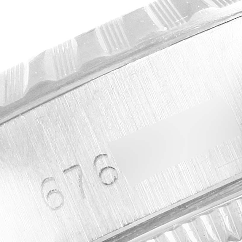 This close-up image shows part of the case and the bezel of a Rolex Date 6924 Women's Stainless Steel Silver Dial 6924 Women's Stainless Steel Silver Dial model watch.