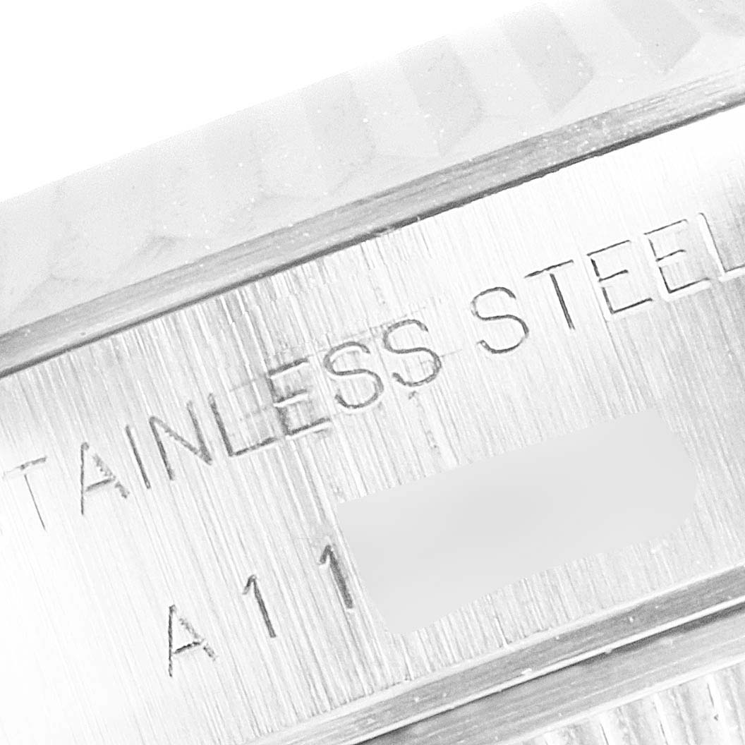 The image shows a close-up of the steel bezel and the engraved serial number area on a Rolex Datejust 79174 Women's Stainless Steel Silver Dial 79174 Women's Stainless Steel Silver Dial watch.