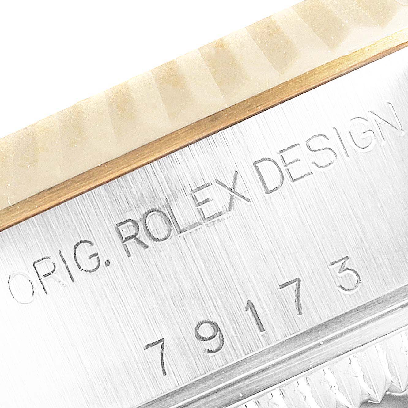 The image shows a close-up of the case and bezel with inscriptions on a Rolex Datejust 79173 Women's Steel and Gold (two tone) Silver Dial 79173 Women's Steel and Gold (two tone) Silver Dial watch.