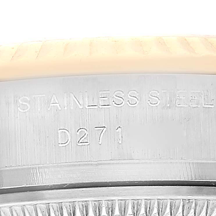 The image shows a close-up of the stainless steel case back of a Rolex Datejust 179173 Women's Steel and Gold (two tone) Silver Dial 179173 Women's Steel and Gold (two tone) Silver Dial watch with visible engraving.