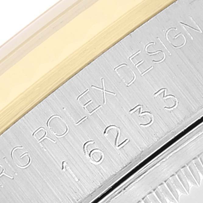 Close-up of the model number and design engraved on the side bezel of the Rolex Datejust 16233 Men's Steel and Gold (two tone) Blue Dial 16233 Men's Steel and Gold (two tone) Blue Dial watch.