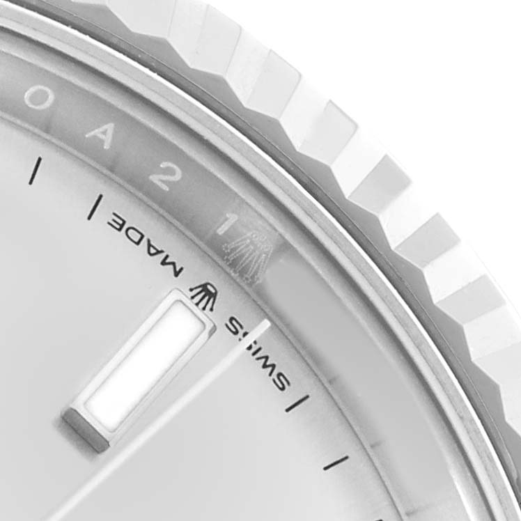 The image shows a close-up of the bezel and part of the dial of the Rolex Datejust 41 126334 Men
s Stainless Steel Silver Dial, highlighting details like the "SWISS MADE" text.