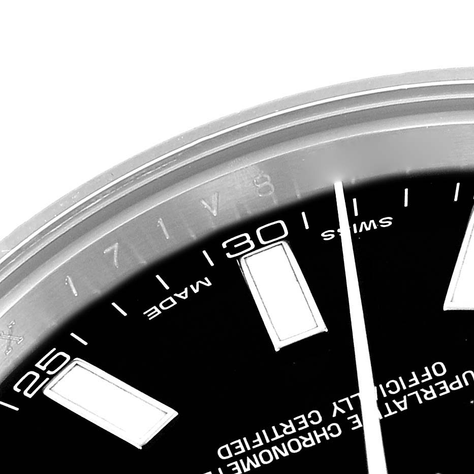 The image shows a close-up of the Rolex Datejust 41 116334 Men
s Stainless Steel Black Dial
s dial, highlighting hour markers, minute markers, and part of the bezel.