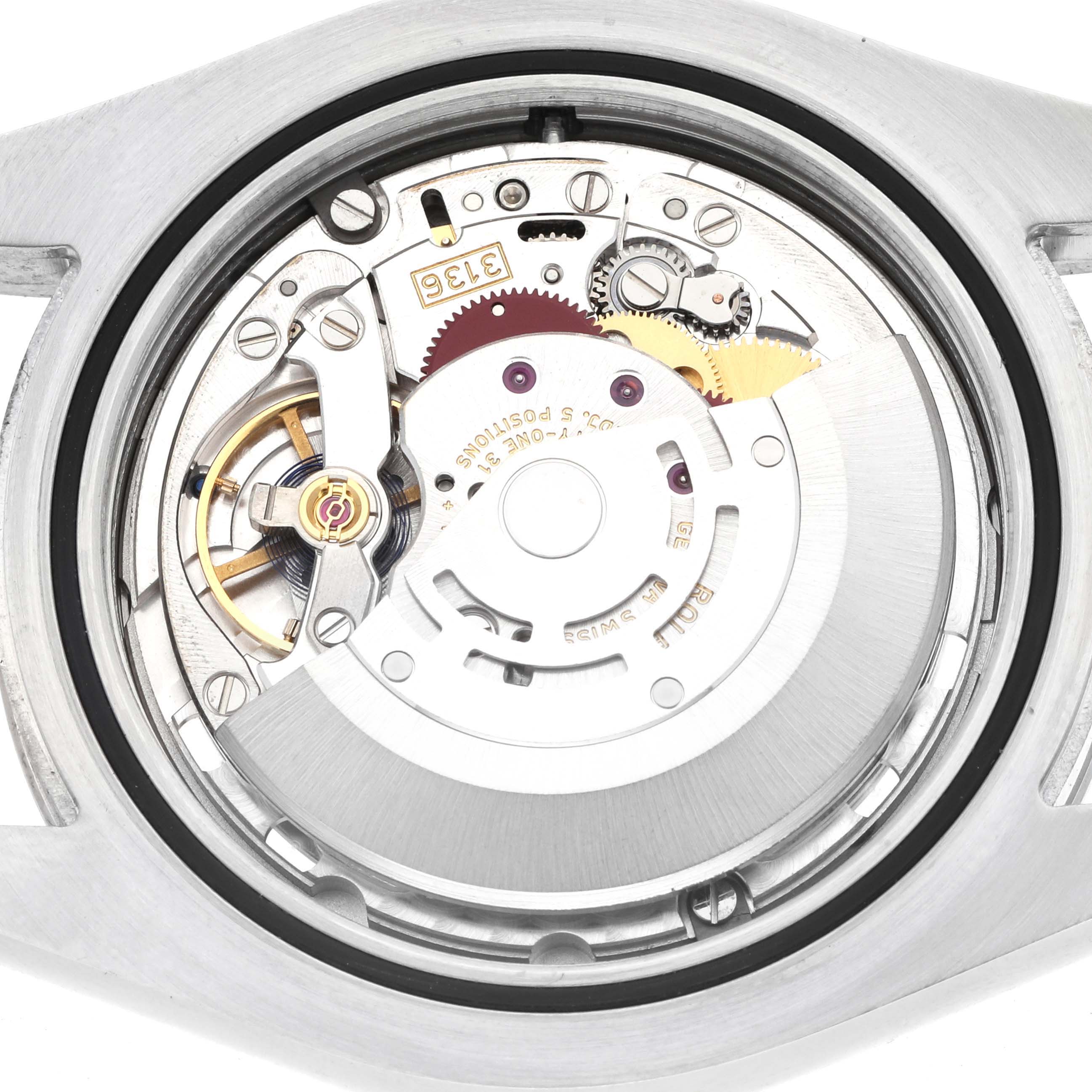 The image shows the movement of a Rolex Datejust 41 116334 Men
s Stainless Steel Black Dial from the back, highlighting gears and components.