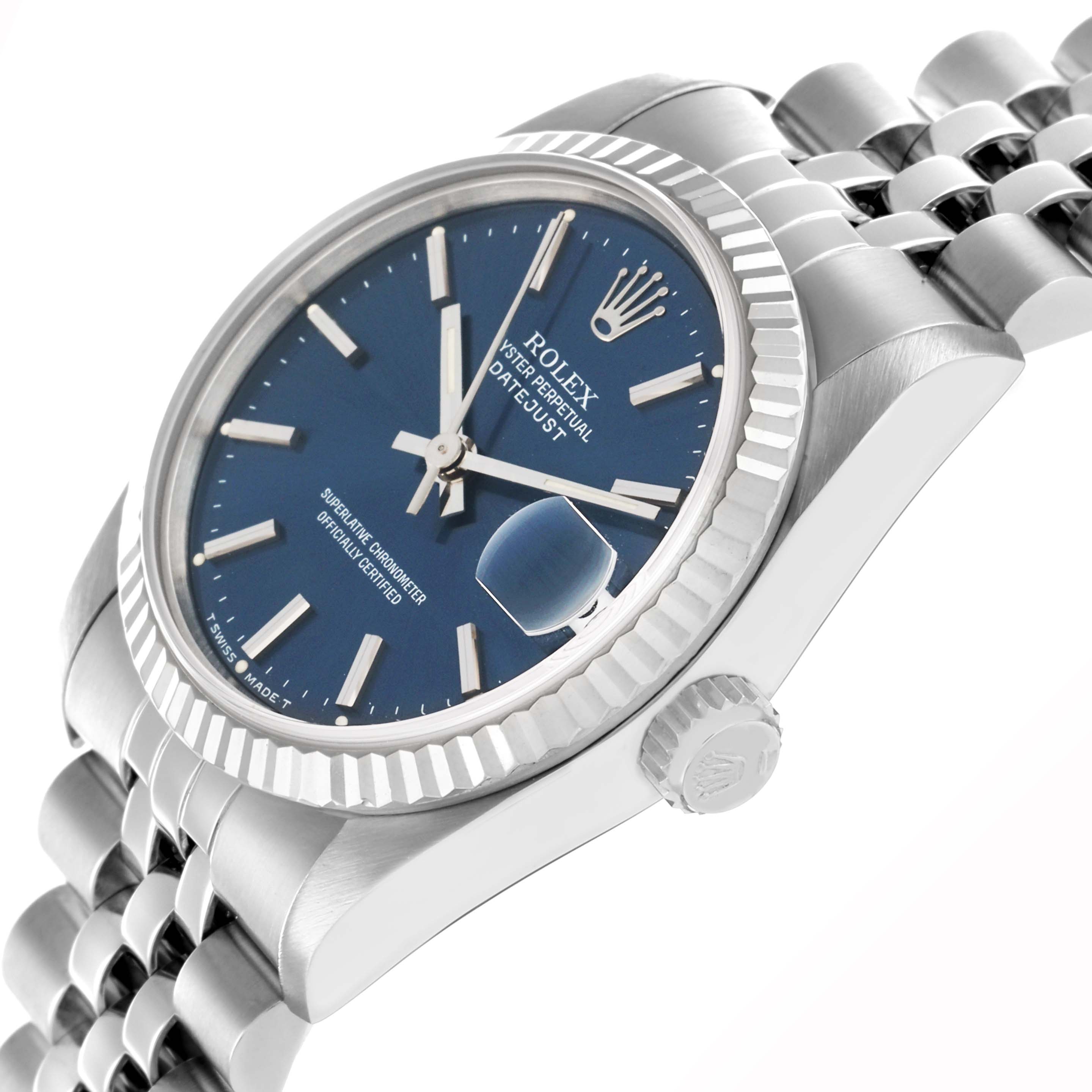 The Rolex Mid-Size 68274 Women's Stainless Steel Blue Dial model is shown at a three-quarter angle, highlighting the blue dial, fluted bezel, and jubilee bracelet.
