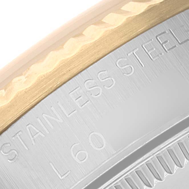 This close-up shows the stainless steel and gold bezel of a Rolex Datejust 68273 Women
s Stainless Steel Champagne Dial 68273 Women
s Stainless Steel Champagne Dial watch.