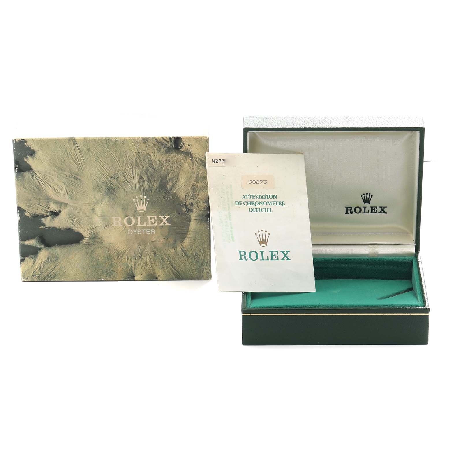 The image shows a Rolex Mid-Size 68273 Women
s Steel and Gold (two tone) Champagne Dial model box, open with a certificate, and the outer cover beside it.