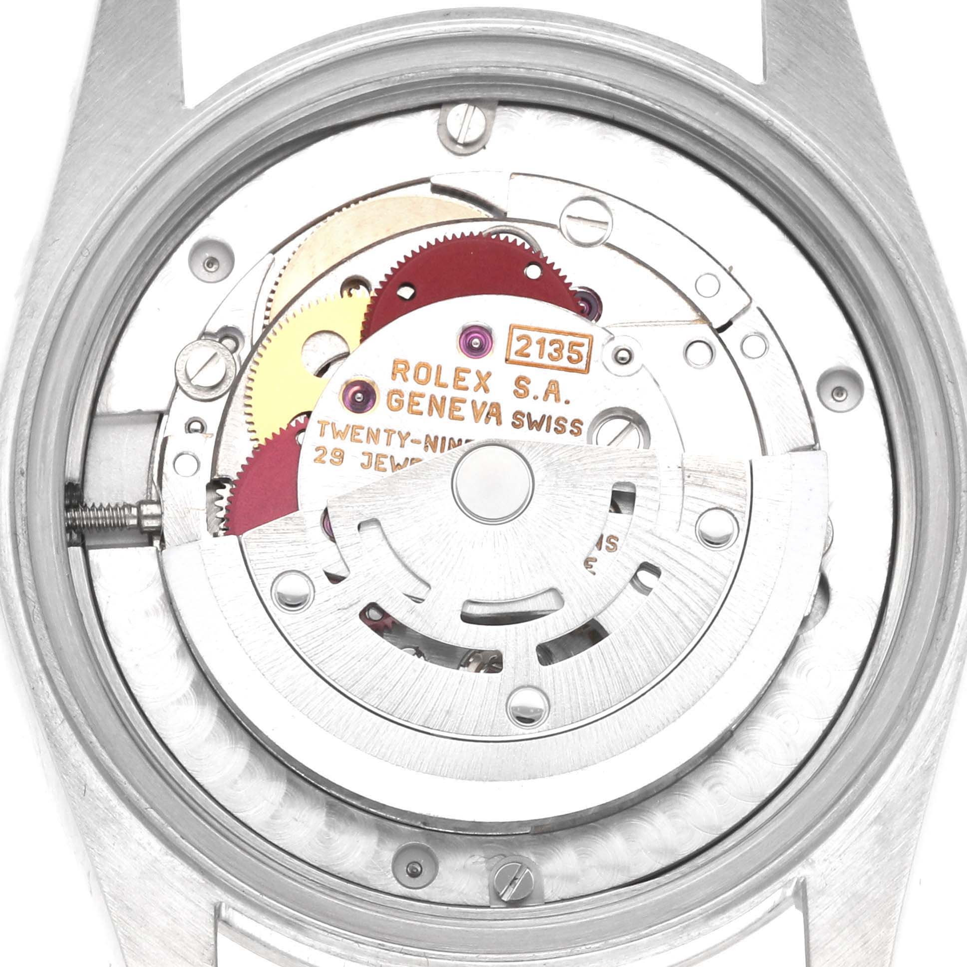 The image shows the internal movement of a Rolex Mid-Size 68274 Women's Stainless Steel White Dial model, viewed from the back with visible gears and markings.