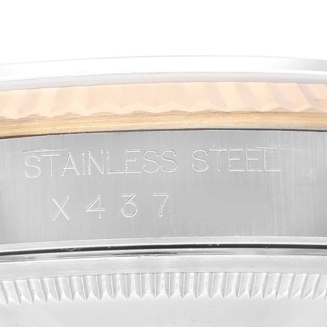 The image shows a close-up of the case back of a Rolex Datejust 16233 Men's Steel and Gold (two tone) Black Dial 16233 Men's Steel and Gold (two tone) Black Dial watch, highlighting the "STAINLESS STEEL" engraving and partial serial number.