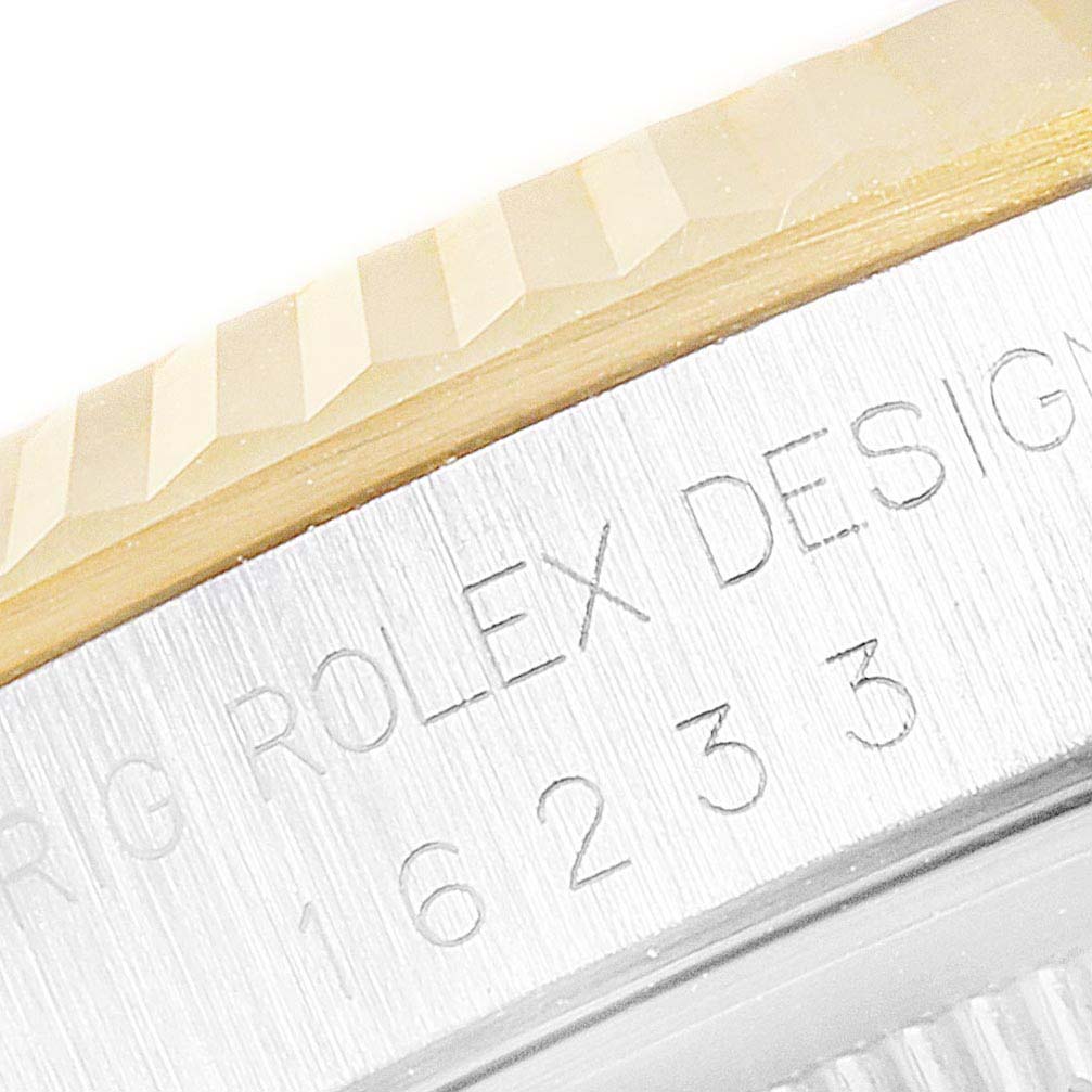 The close-up image shows the bezel and the engraved side of the Rolex Datejust 16233 Men's Steel and Gold (two tone) Champagne Dial 16233 Men's Steel and Gold (two tone) Champagne Dial watch case.