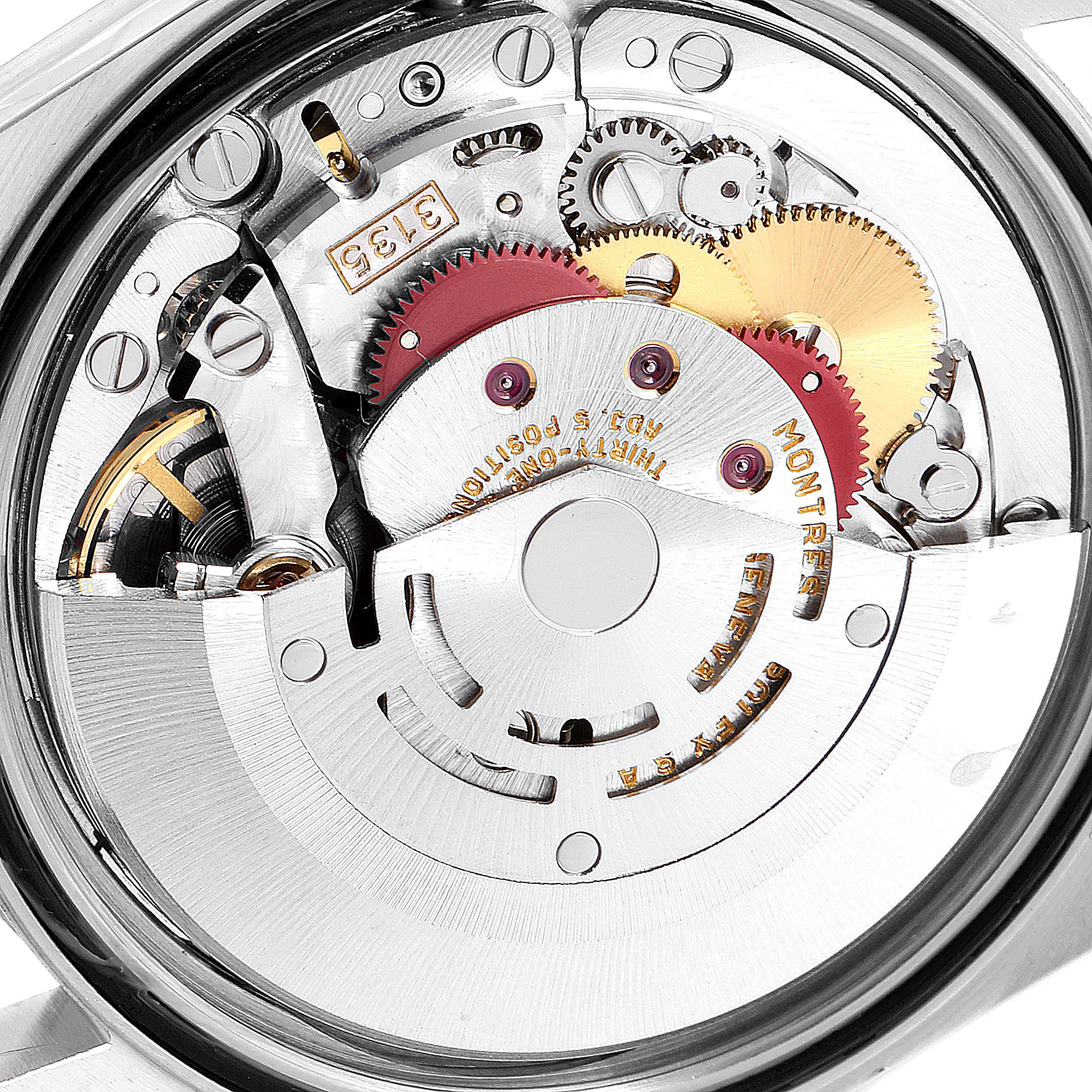 This image shows the inner mechanical components of a Rolex Datejust 16233 Men's Steel and Gold (two tone) Champagne Dial 16233 Men's Steel and Gold (two tone) Champagne Dial watch from a back angle, highlighting gears and engraving details.
