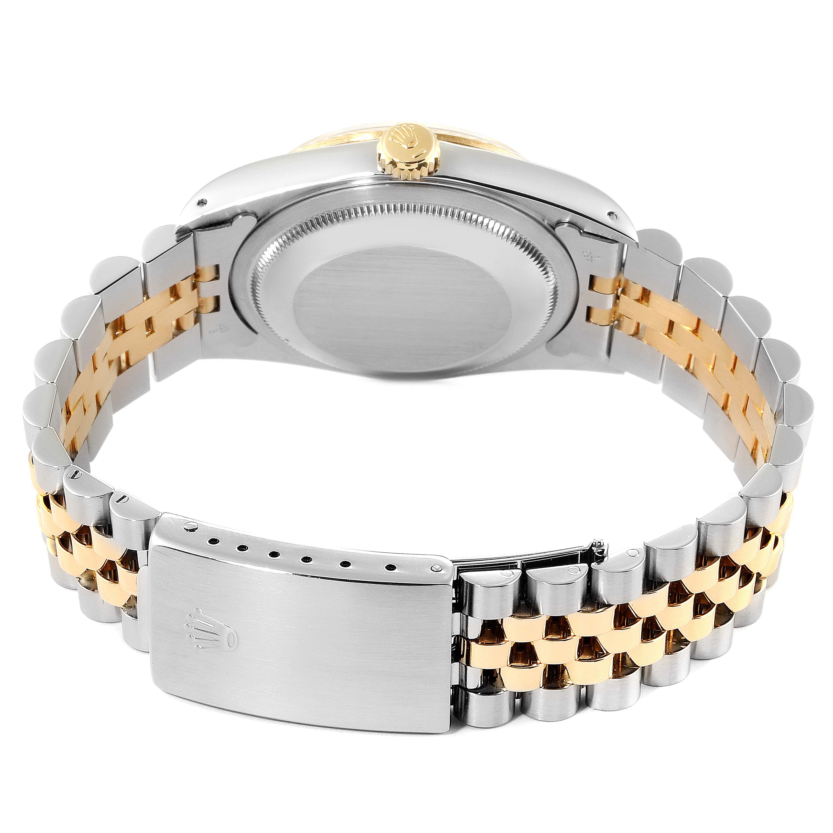 The image shows the back and clasp of a Rolex Datejust 16233 Men's Steel and Gold (two tone) Champagne Dial 16233 Men's Steel and Gold (two tone) Champagne Dial watch, highlighting its two-tone bracelet and case back.