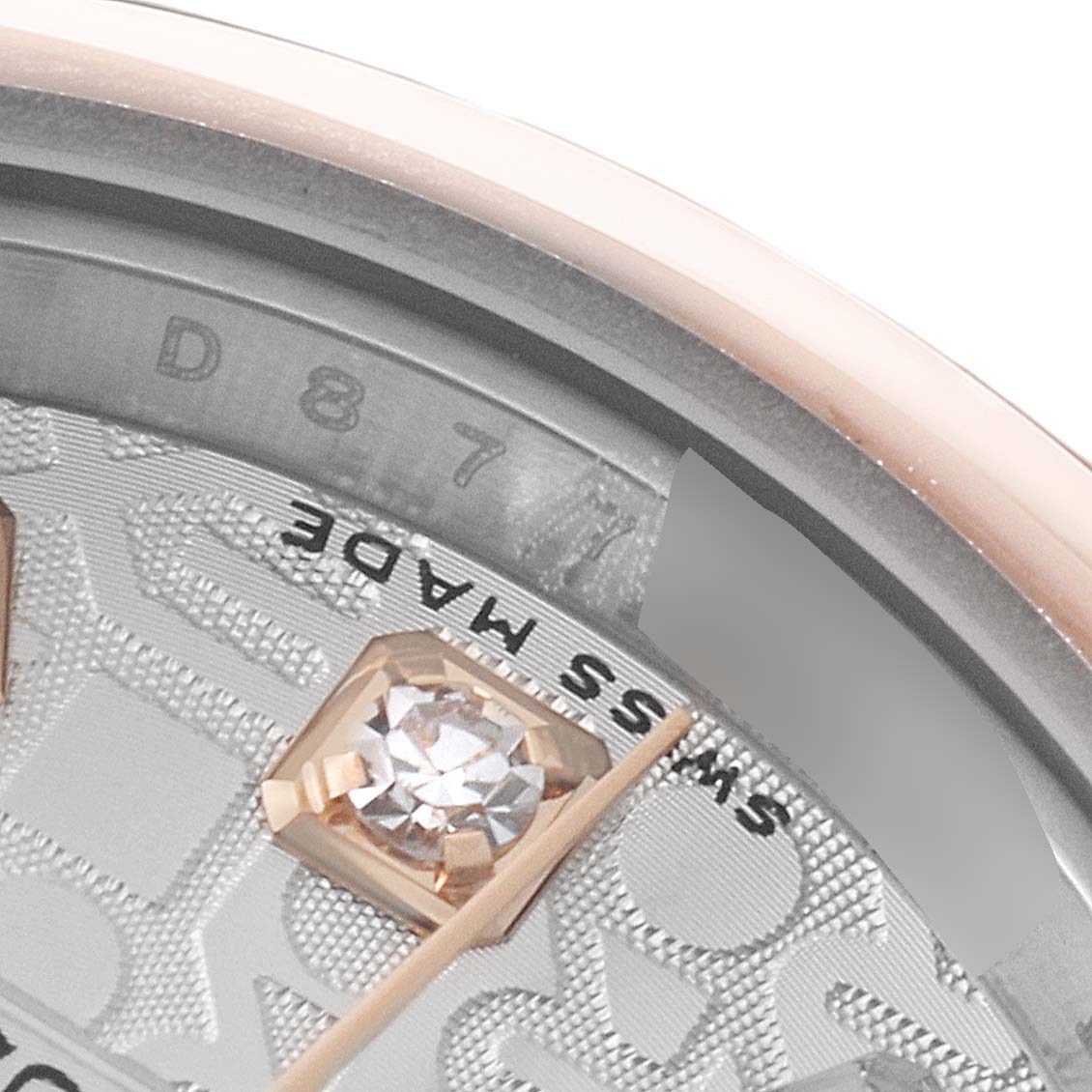 The image shows a close-up of the dial and gemstone marker of a Rolex Datejust 179161 Women's Steel and Gold (two tone) Silver Dial 179161 Women's Steel and Gold (two tone) Silver Dial watch, featuring the "Swiss Made" text.