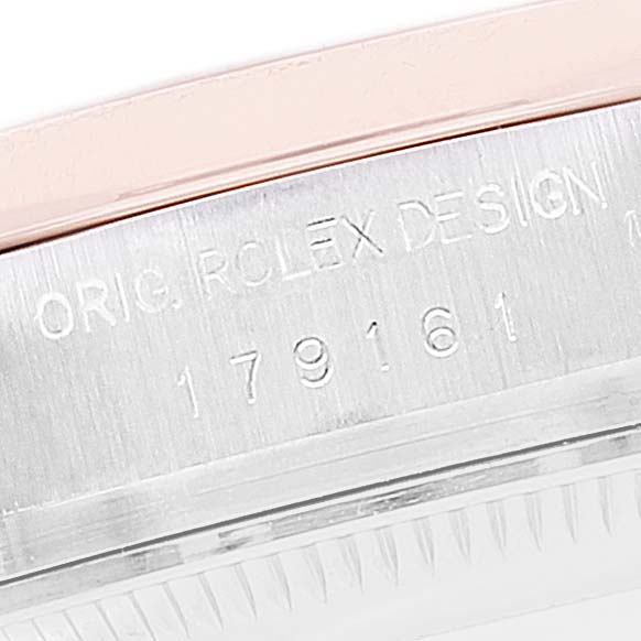 The image shows a close-up of the caseback edge of a Rolex Datejust 179161 Women's Steel and Gold (two tone) Silver Dial 179161 Women's Steel and Gold (two tone) Silver Dial, revealing engraving details.