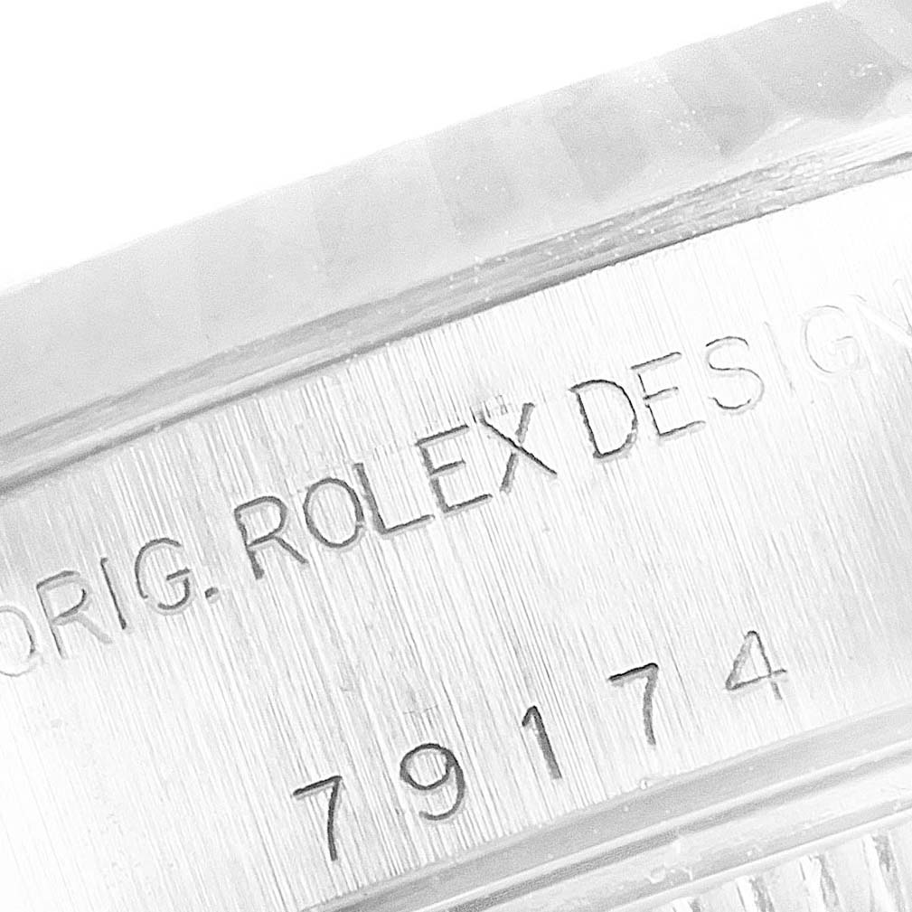 The image shows a close-up angle of the case side on a Rolex Datejust 79174 Women's Stainless Steel Silver Dial 79174 Women's Stainless Steel Silver Dial watch, highlighting the engraved model number.