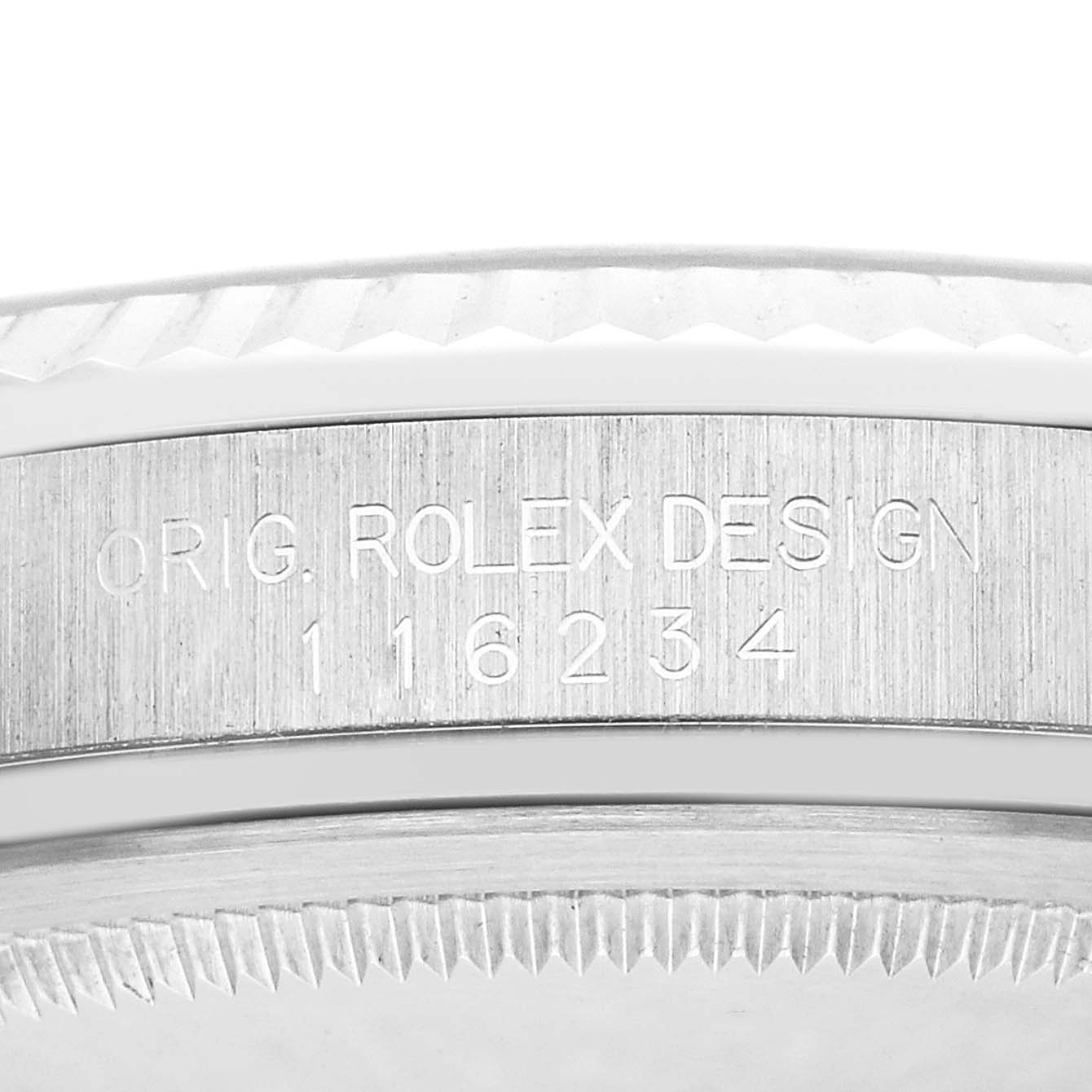 The image shows a close-up of the Rolex Datejust 116234 Men
s Stainless Steel Black Dial
s bezel with the engravings "ORIG. ROLEX DESIGN" and the model number.