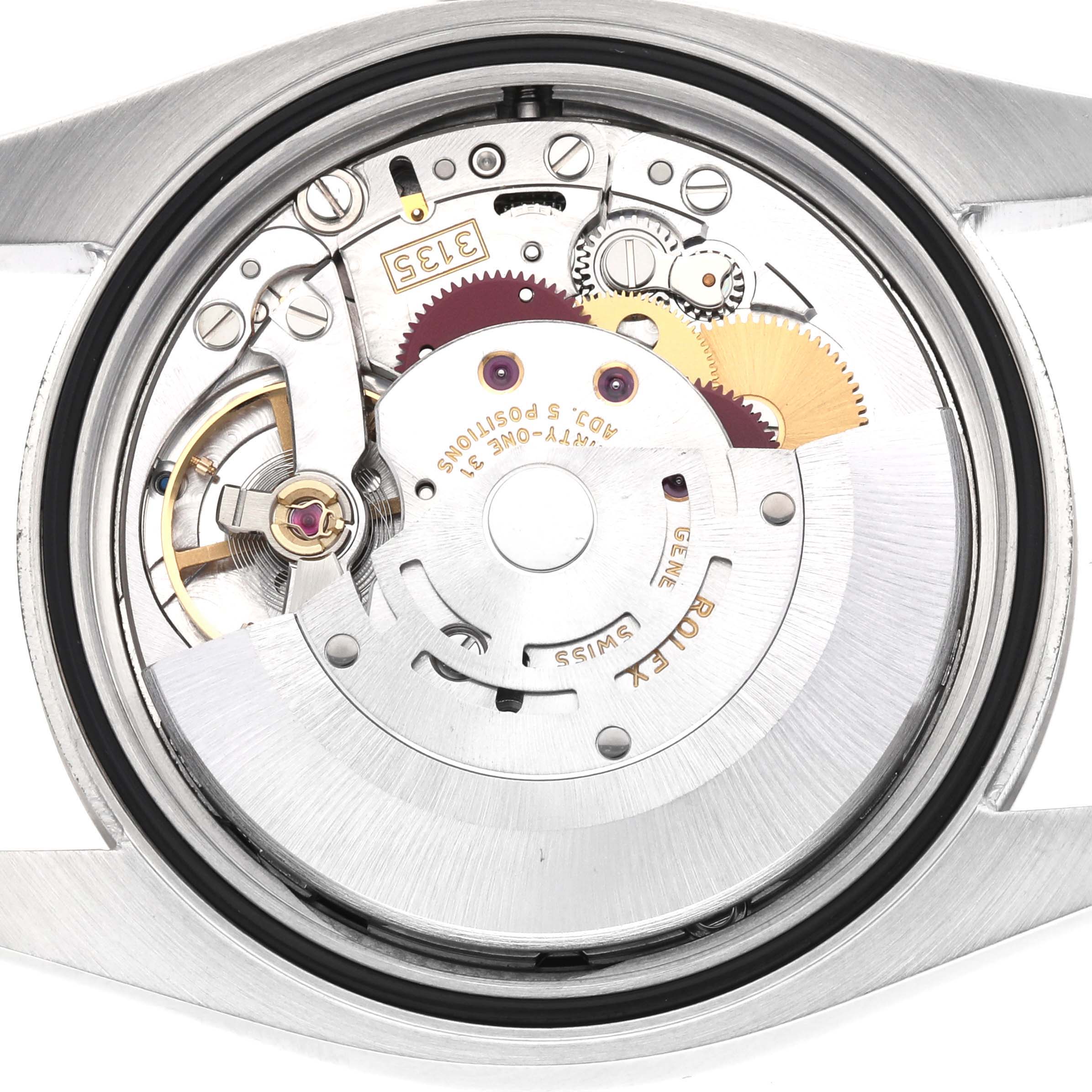 The image shows the movement of a Rolex Datejust 116234 Men
s Stainless Steel Black Dial watch from a rear angle, highlighting gears and mechanical parts.