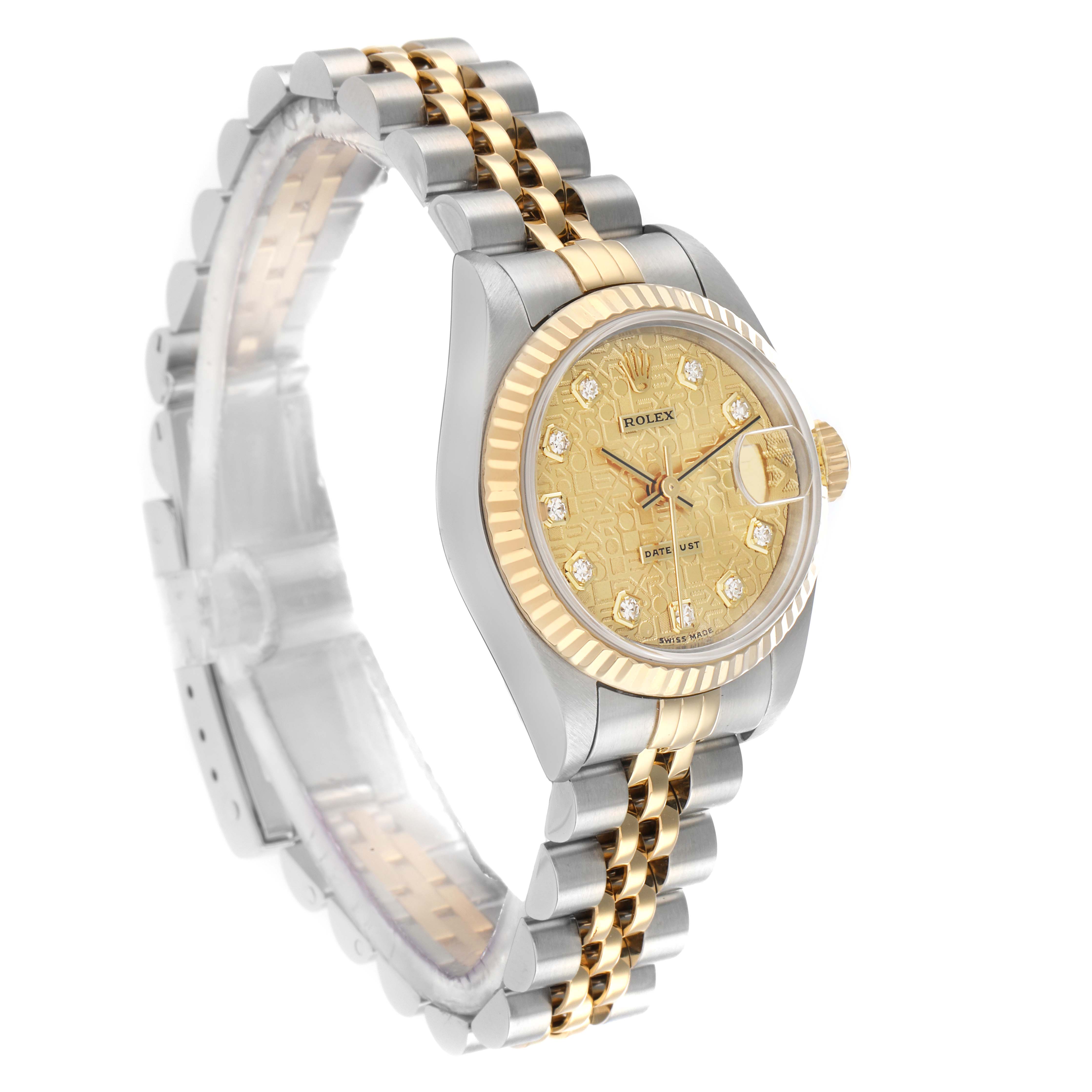 The Rolex Datejust 79173 Women's Steel and Gold (two tone) Champagne Dial watch is shown at a tilted angle, highlighting the gold dial, fluted bezel, and Jubilee bracelet.