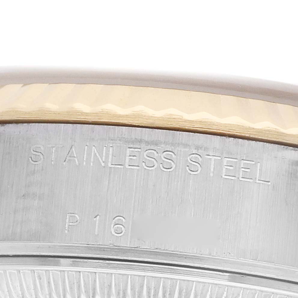 The image shows a close-up of the side of a Rolex Datejust 79173 Women's Steel and Gold (two tone) Champagne Dial watch, highlighting the stainless steel and part of the bezel.
