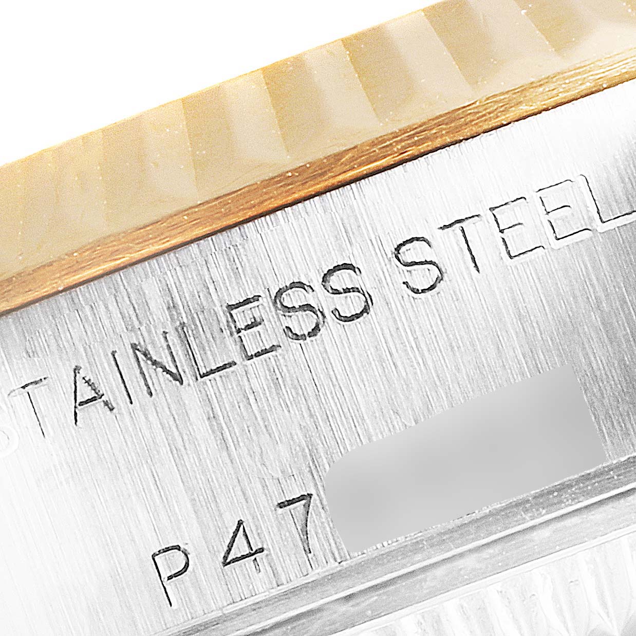 This close-up image shows the stainless steel casing and part of the bezel of a Rolex Datejust 79173 Women's Steel and Gold (two tone) Champagne Dial 79173 Women's Steel and Gold (two tone) Champagne Dial watch.