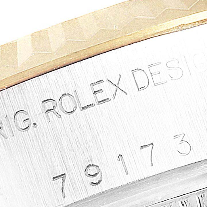 The image shows a close-up of the engraved side of a Rolex Datejust 79173 Women's Stainless Steel Silver Dial 79173 Women's Stainless Steel Silver Dial watch case.