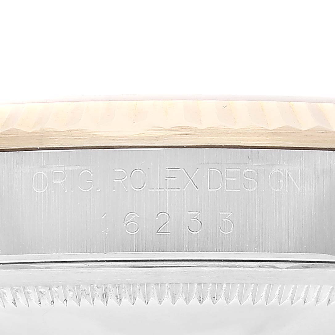 The image shows the engraved side of the case of a Rolex Datejust 16233 Men's Steel and Gold (two tone) Champagne Dial 16233 Men's Steel and Gold (two tone) Champagne Dial, displaying the model number.