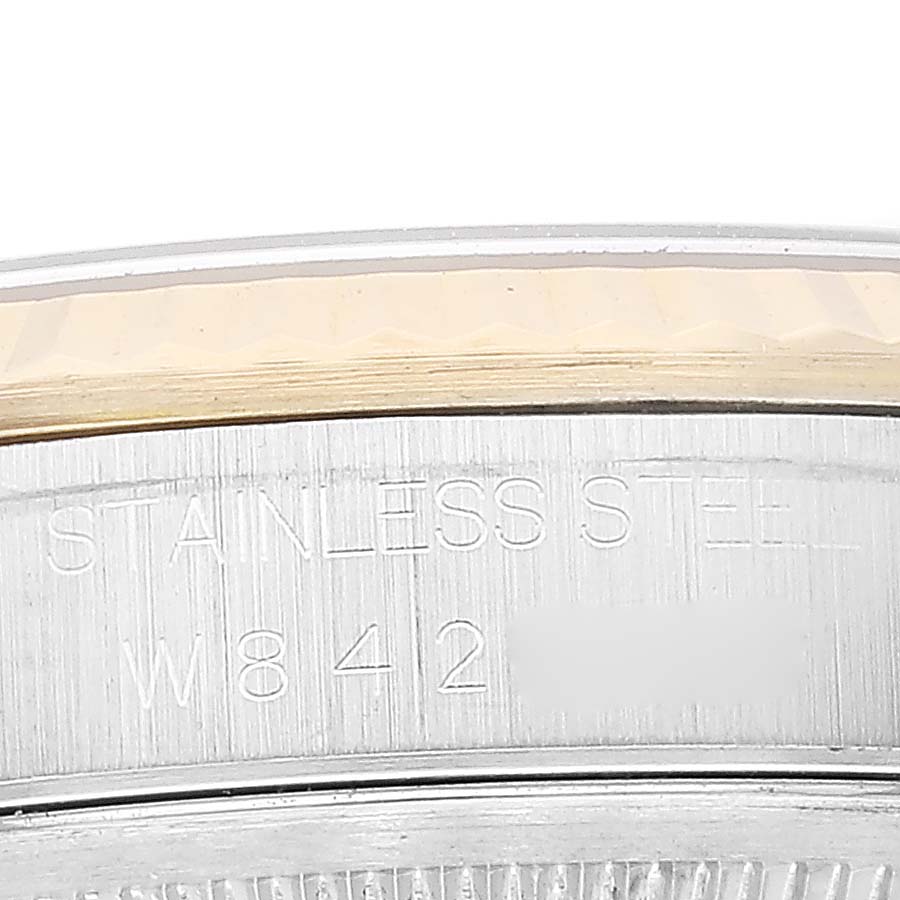 This image shows a close-up of the side casing and bezel of a Rolex Datejust 16233 Men's Steel and Gold (two tone) Champagne Dial 16233 Men's Steel and Gold (two tone) Champagne Dial watch.