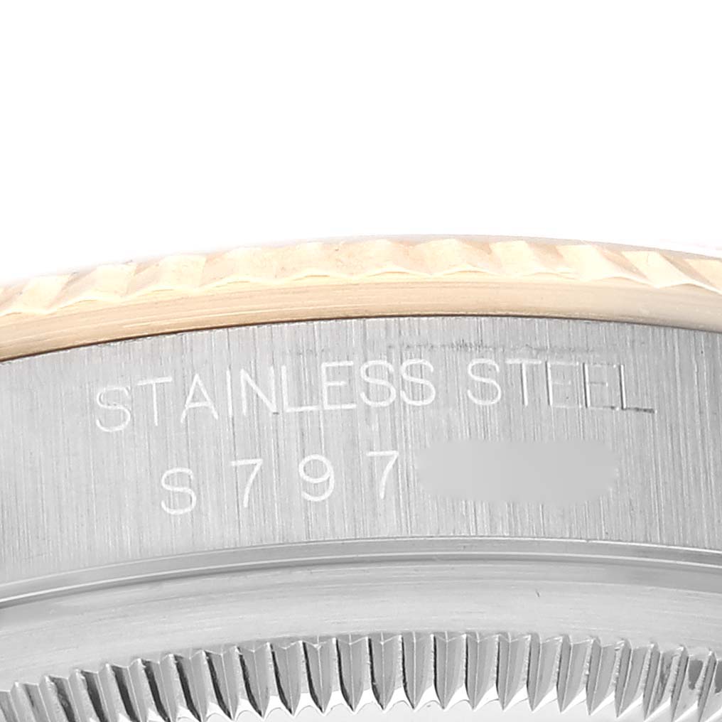 This image shows a close-up of the side of a Rolex Datejust 16233 Men's Steel and Gold (two tone) Champagne Dial 16233 Men's Steel and Gold (two tone) Champagne Dial watch, highlighting the stainless steel marking and serial number.