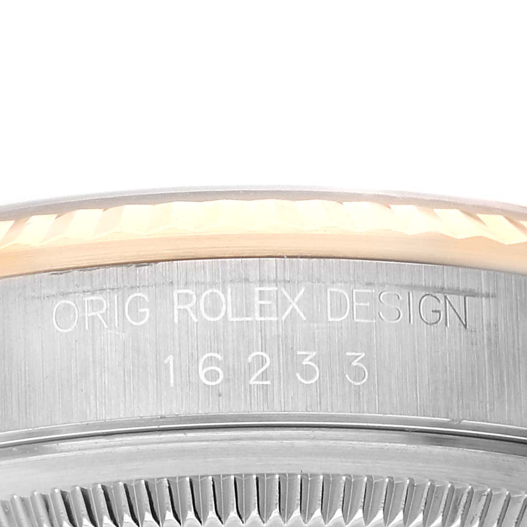 This image shows a close-up angle of the side, including the bezel and engraved model number, of a Rolex Datejust 16233 Men's Steel and Gold (two tone) Champagne Dial 16233 Men's Steel and Gold (two tone) Champagne Dial watch.