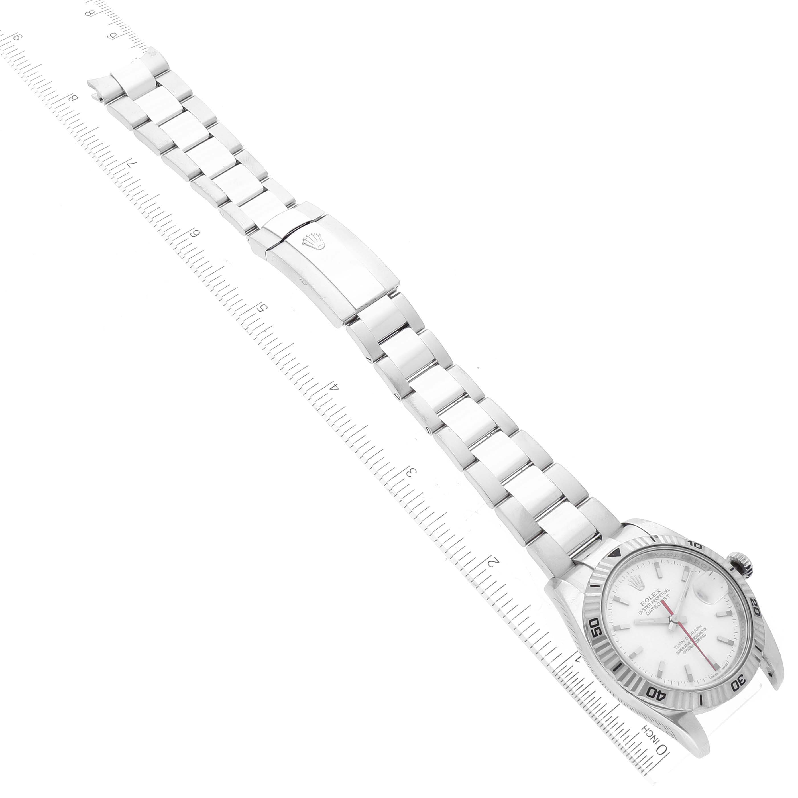 The Rolex Turn-o-Graph 116264 Men's Stainless Steel White Dial 116264 Men's Stainless Steel White Dial watch is shown from an angled top view, displaying both the face and the full bracelet next to a ruler.