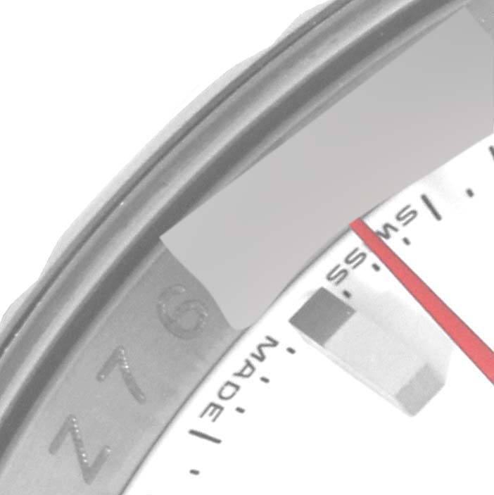 This image shows a close-up of part of the dial and bezel of a Rolex Turn-o-Graph 116264 Men's Stainless Steel White Dial 116264 Men's Stainless Steel White Dial watch.
