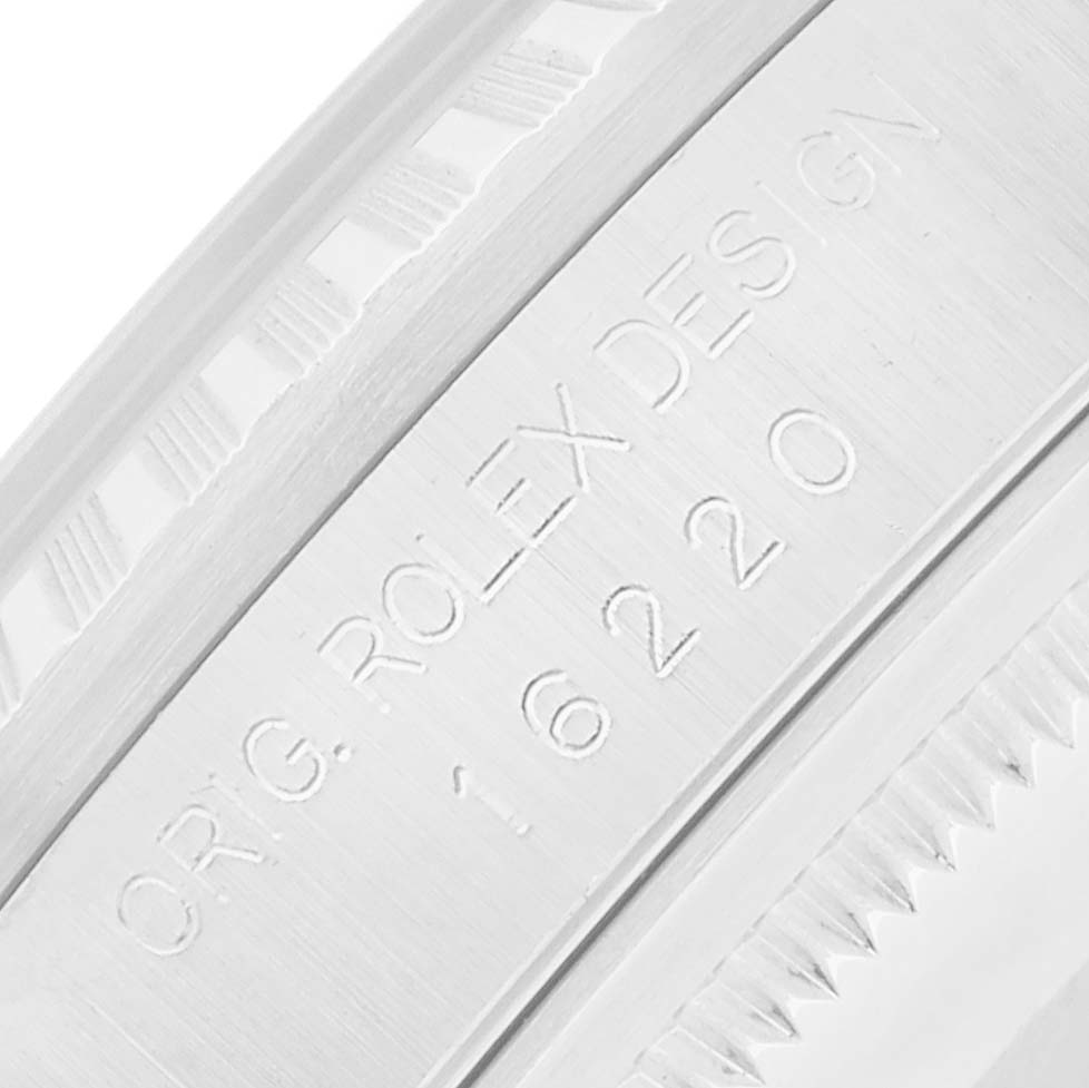 The image shows a close-up of the engraved inner bezel of a Rolex Datejust 16220 Men's Stainless Steel White Dial watch.