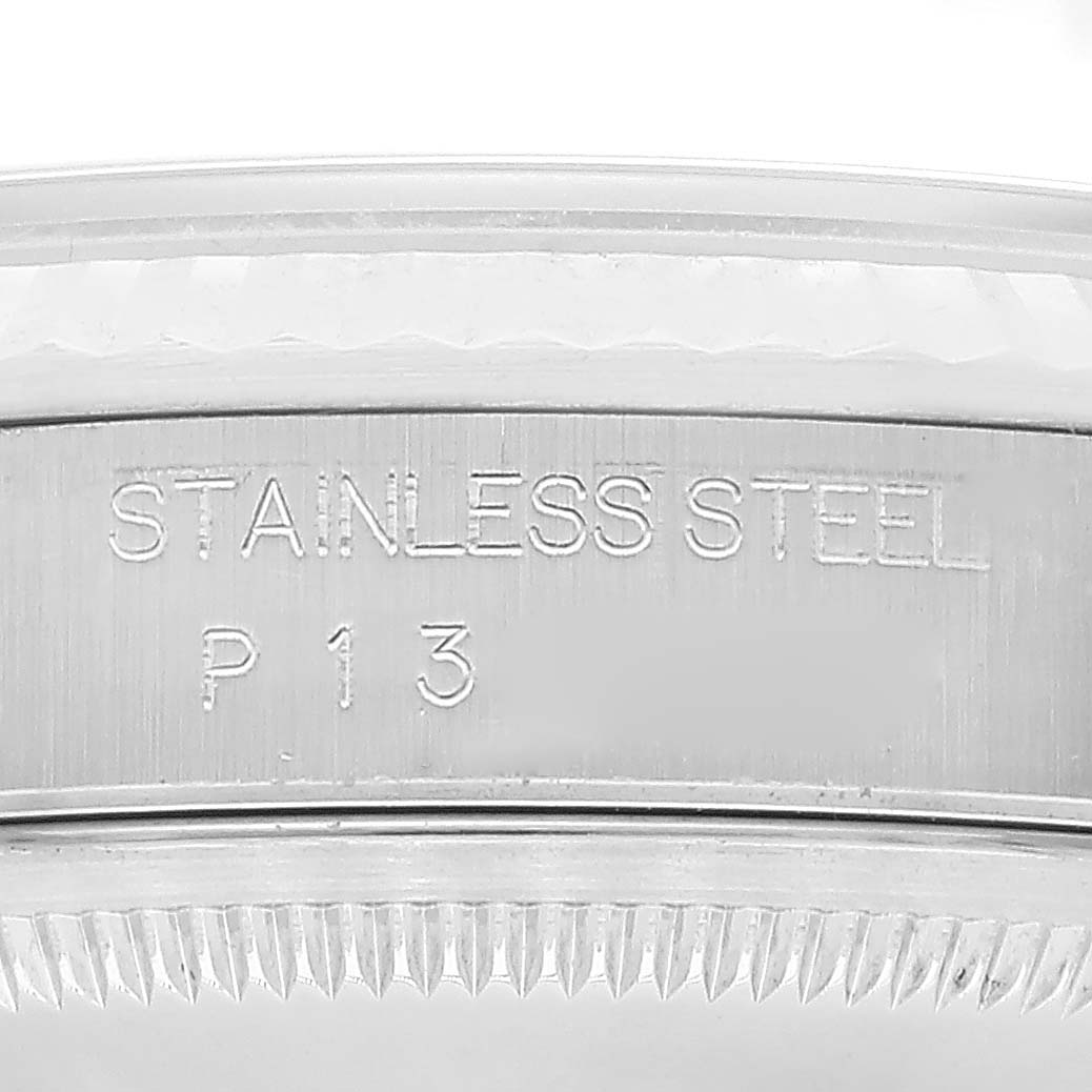 The image shows a close-up of the stainless steel bezel of a Rolex Datejust 16234 Men's Stainless Steel White Dial 16234 Men's Stainless Steel White Dial watch, featuring the inscription "STAINLESS STEEL P13."