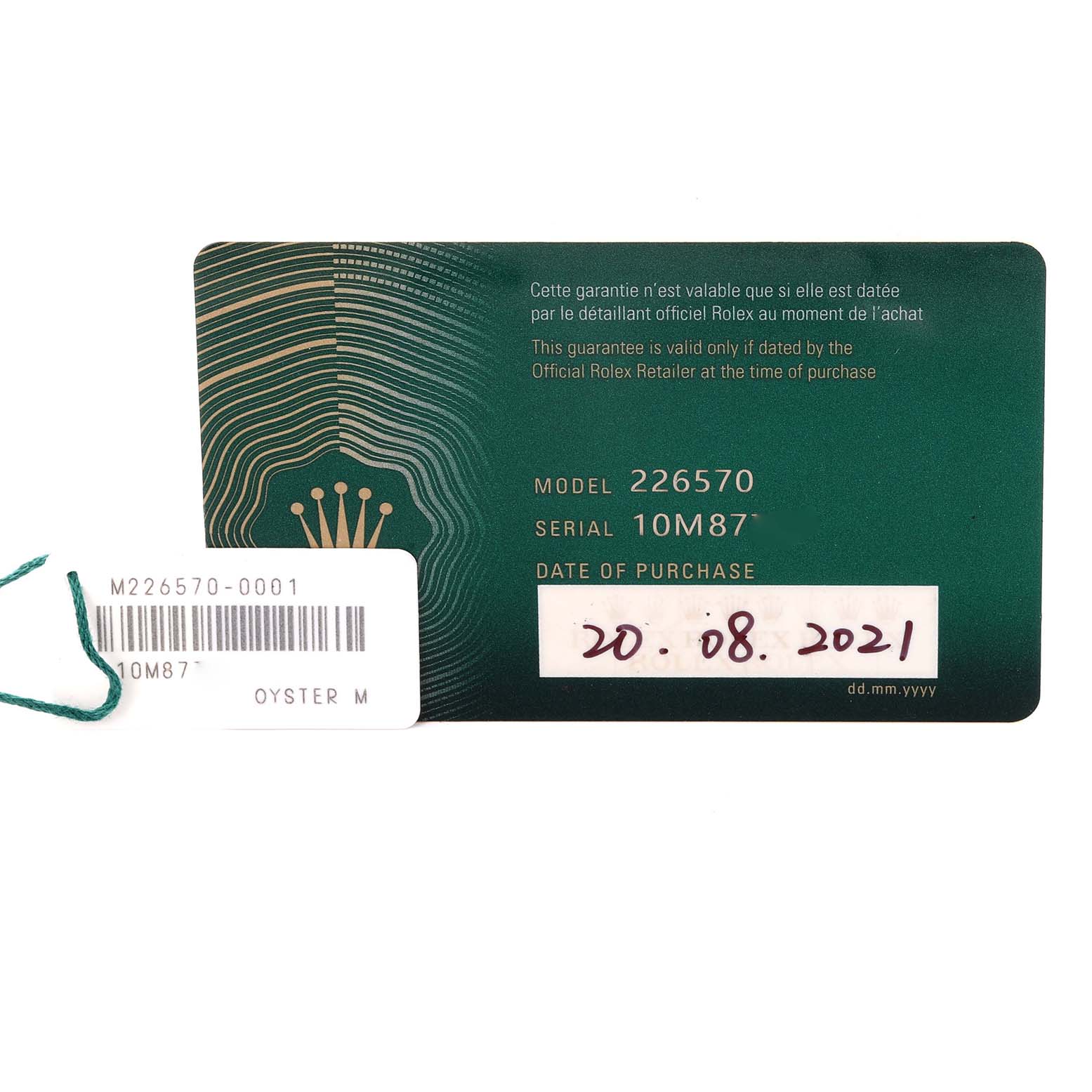 The image shows a warranty card for a Rolex Explorer 226570 Men's Stainless Steel White Dial 226570 Men's Stainless Steel White Dial model 226570 with serial number 10M87, and a tag with the same serial number.