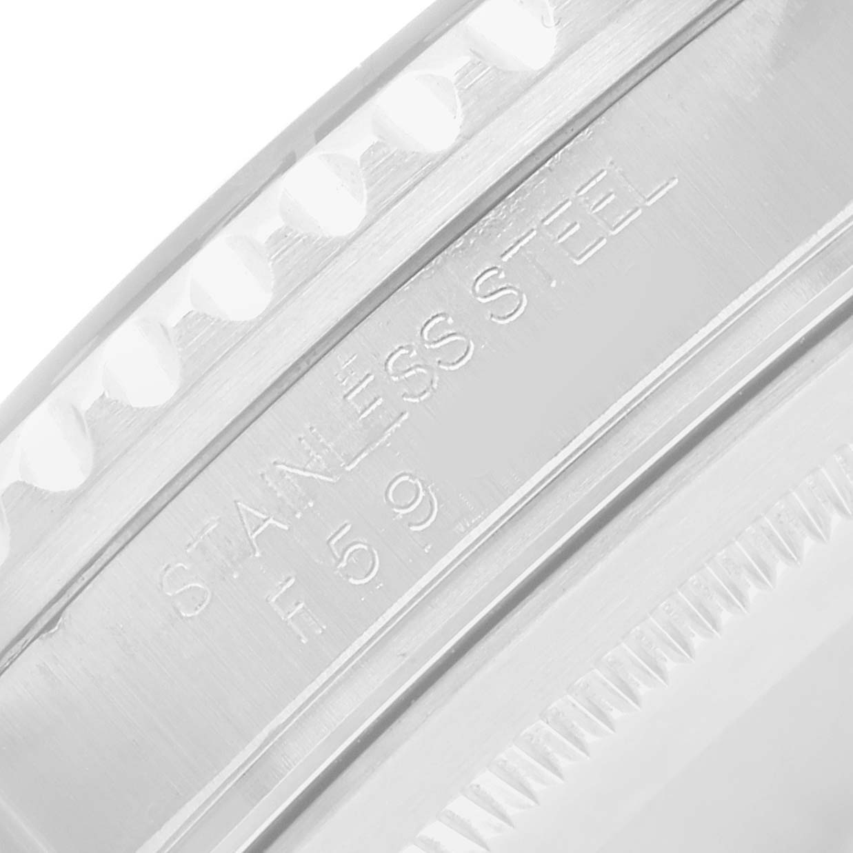 The image shows a close-up of the bezel side with "STAINLESS STEEL" engraved on the Rolex GMT-Master 16710 Men's Stainless Steel Black Dial watch.