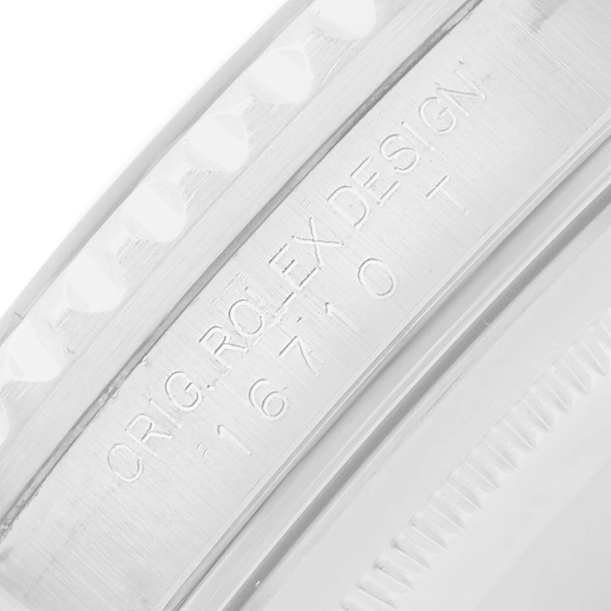 The image shows a close-up of the inner case edge of a Rolex GMT-Master 16710 Men's Stainless Steel Black Dial, highlighting the engraved model details.