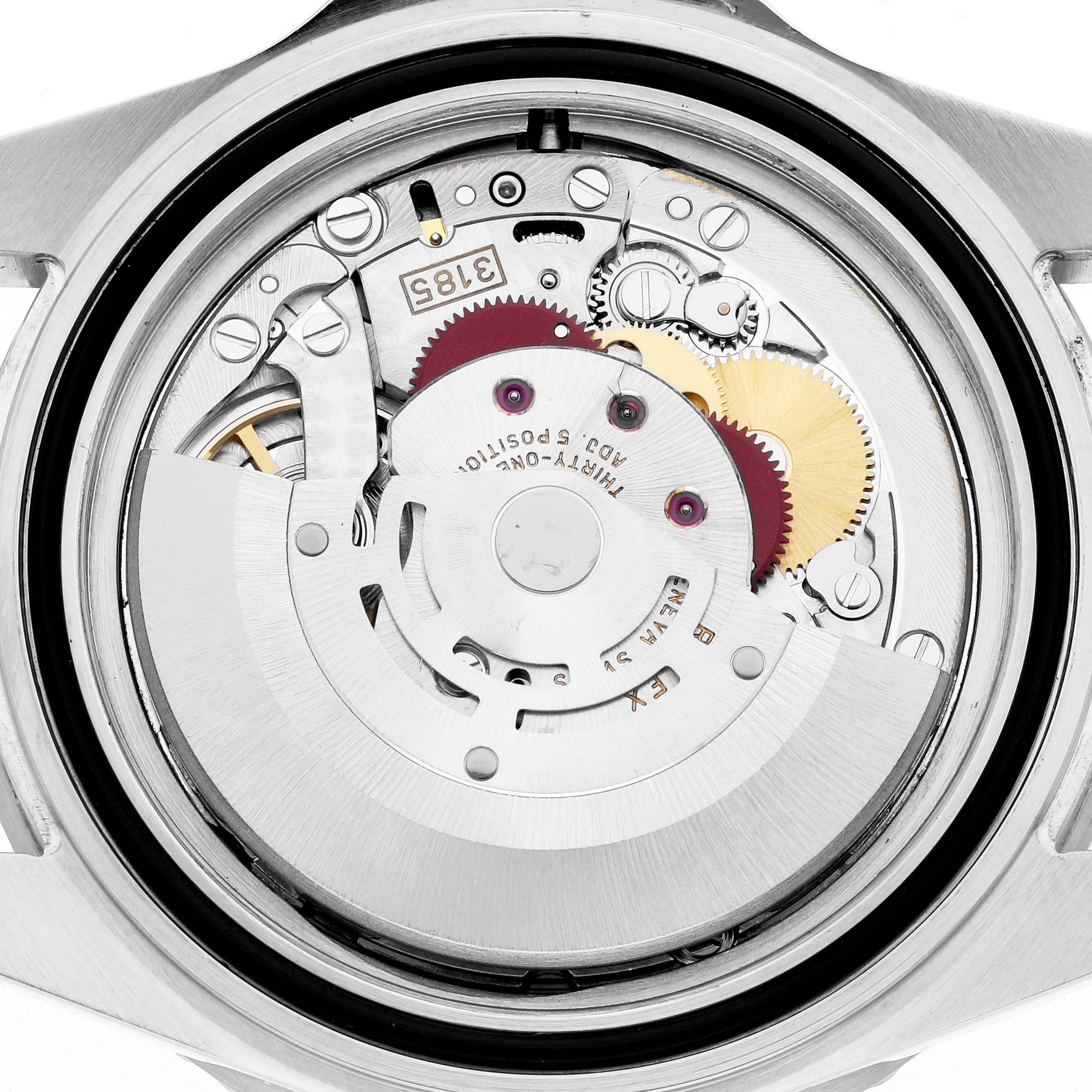 This is a close-up view of the movement inside a Rolex GMT-Master 16710 Men's Stainless Steel Black Dial, showing the intricate gears and rotor.