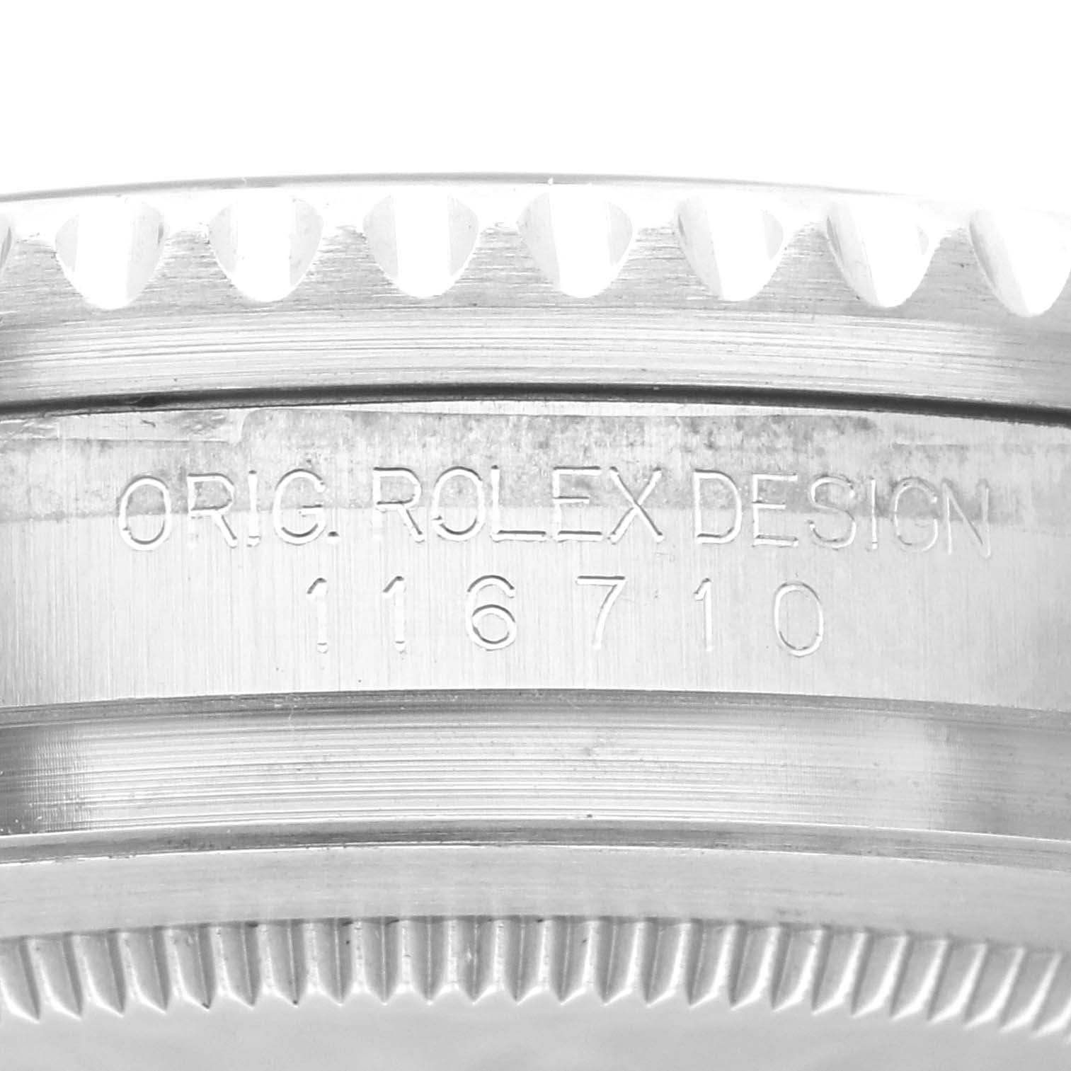 This image shows a close-up of the side of a Rolex GMT-Master 116710 Men's Stainless Steel Black Dial 116710 Men's Stainless Steel Black Dial watch case, displaying the engraved model number 116710.