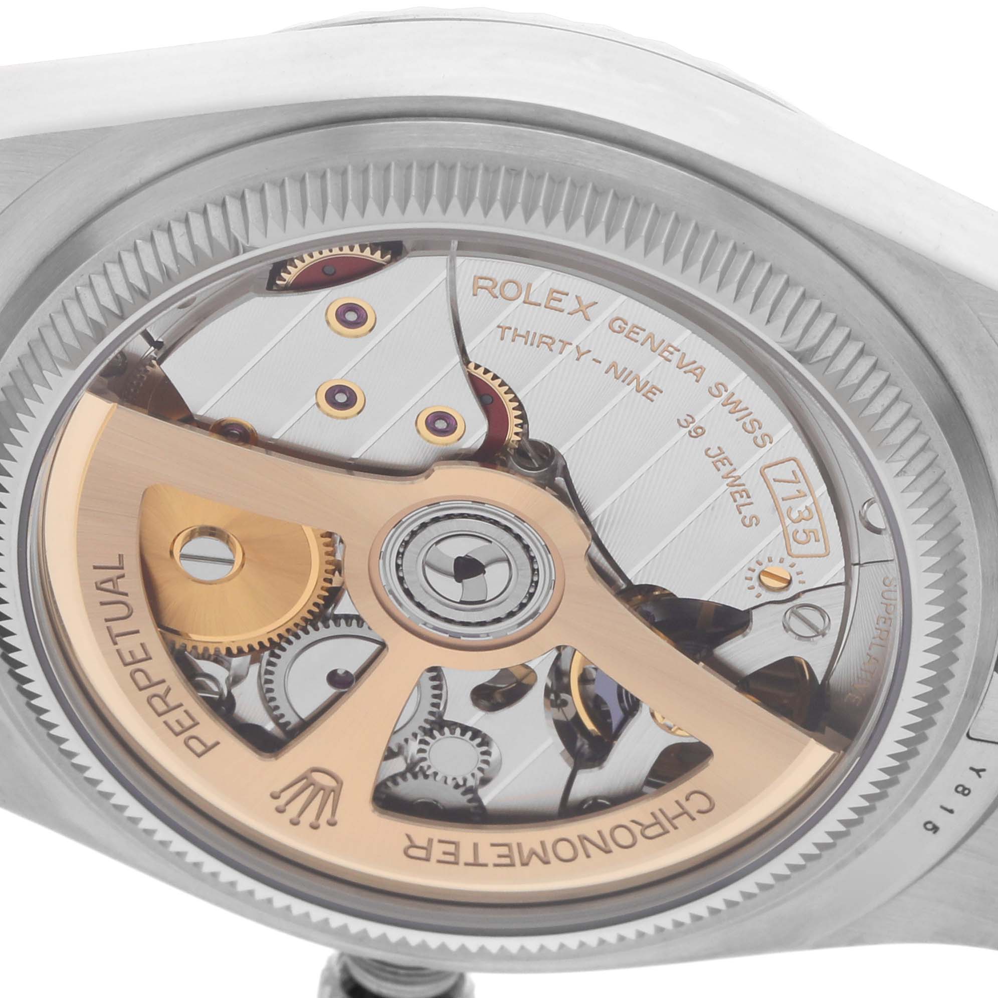 The image shows the back view of a Rolex Land-Dweller, highlighting its intricate internal mechanism and rotor.