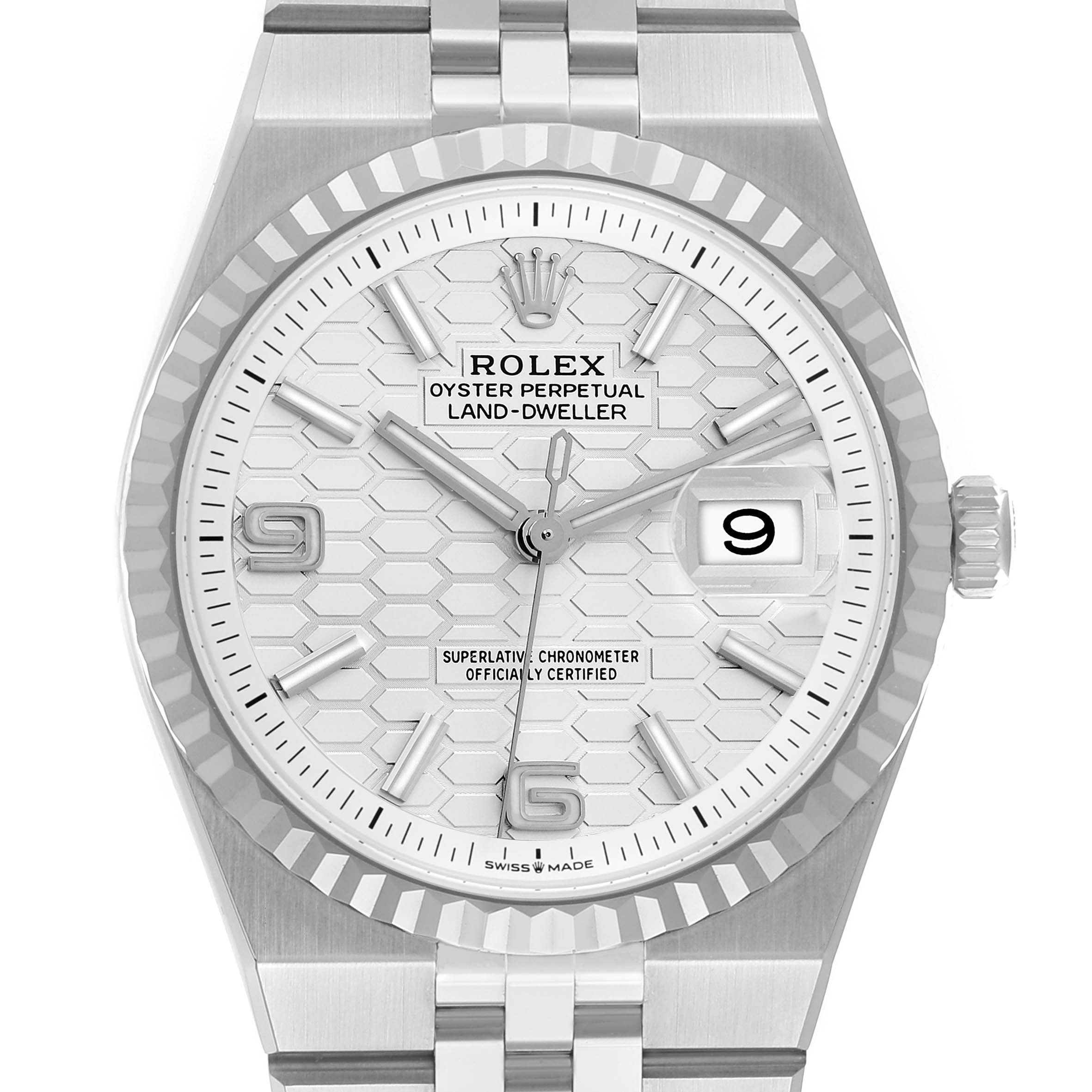 The image shows a Rolex Land-Dweller watch from a front angle, highlighting the dial, bezel, and part of the bracelet.