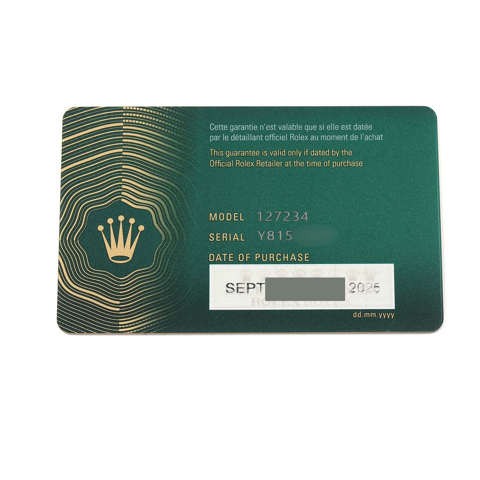 The image shows the warranty card for a Rolex Land-Dweller watch, featuring model and serial numbers.