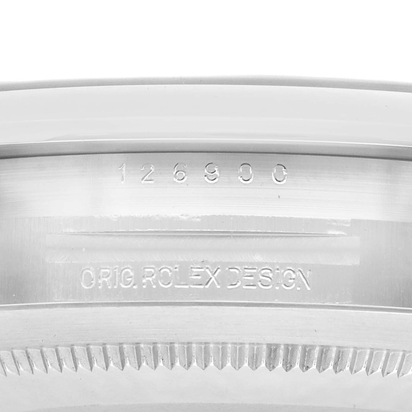 The image shows the inner bezel with engraved details of the Rolex Air-King 126900 Men's Stainless Steel Black Dial watch, including its model number.
