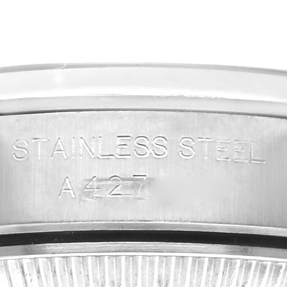 This image shows a close-up angle of the case side of a Rolex Oyster Perpetual 76080 Women's Stainless Steel Pink Dial 76080 Women's Stainless Steel Pink Dial watch, highlighting the stainless steel material.