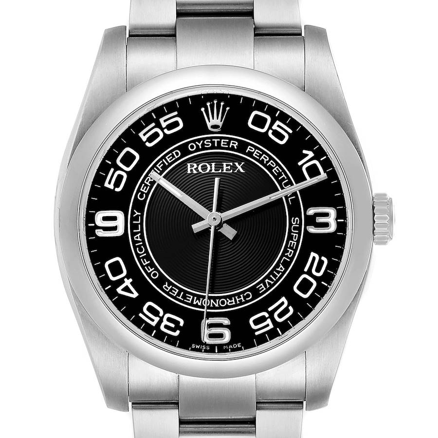 The Rolex Oyster Perpetual 116000 Men's Stainless Steel Black Dial watch is shown from a front angle, displaying its dial, bezel, and part of the bracelet.