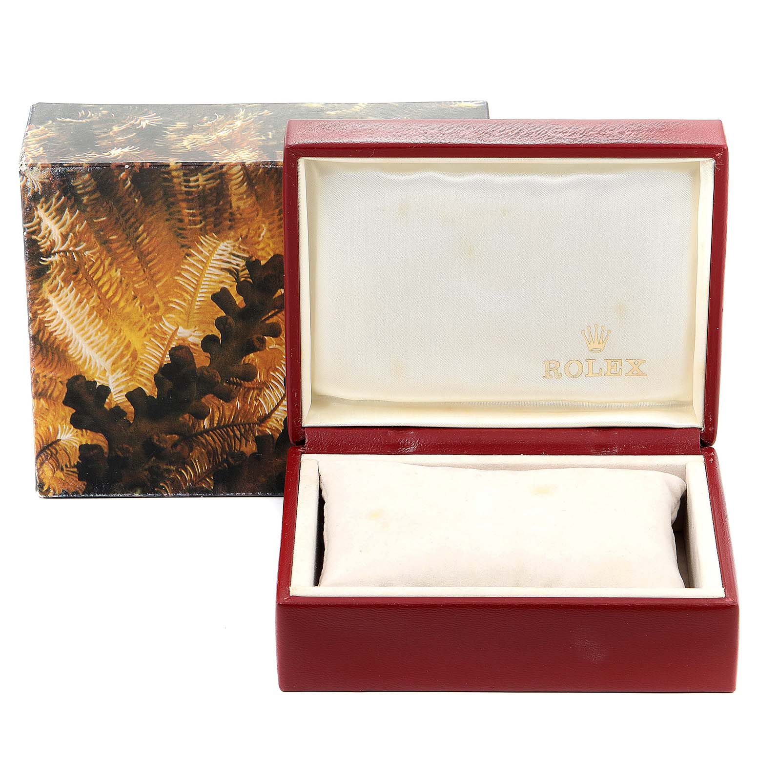 This image displays an empty Rolex Oyster Perpetual 67193 Women
s Steel and Gold (two tone) Silver Dial 67193 Women
s Steel and Gold (two tone) Silver Dial watch box with a decorative outer sleeve.