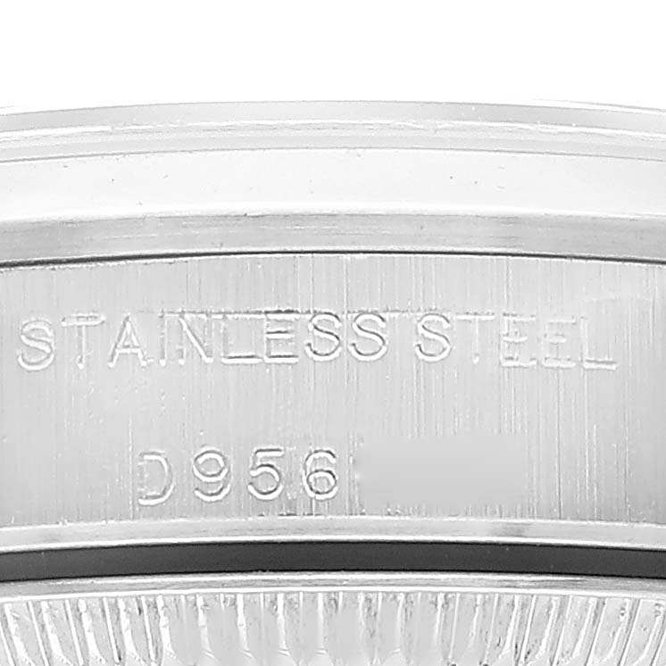 This image shows a close-up of the stainless steel case and part of the serial number on a Rolex Oyster Perpetual 76080 Women
s Stainless Steel Silver Dial 76080 Women
s Stainless Steel Silver Dial watch.