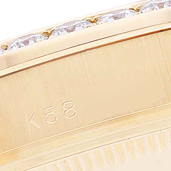 The image shows a close-up of the engraved bezel of a Rolex Pearlmaster 81158 Women's Yellow Gold Mother of Pearl Dial 81158 Women's Yellow Gold Mother of Pearl Dial watch with visible diamonds.